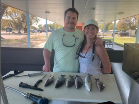Two people enjoying a day of fishing in Miami