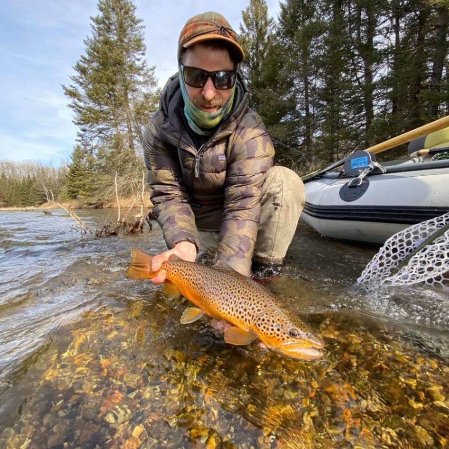 Fisherman holds 12-inch fish in MI