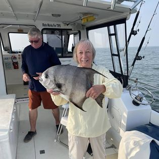 Two anglers with a big 22-inch fish in VA