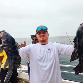 Two anglers with a big 38-inch catch in Hampton