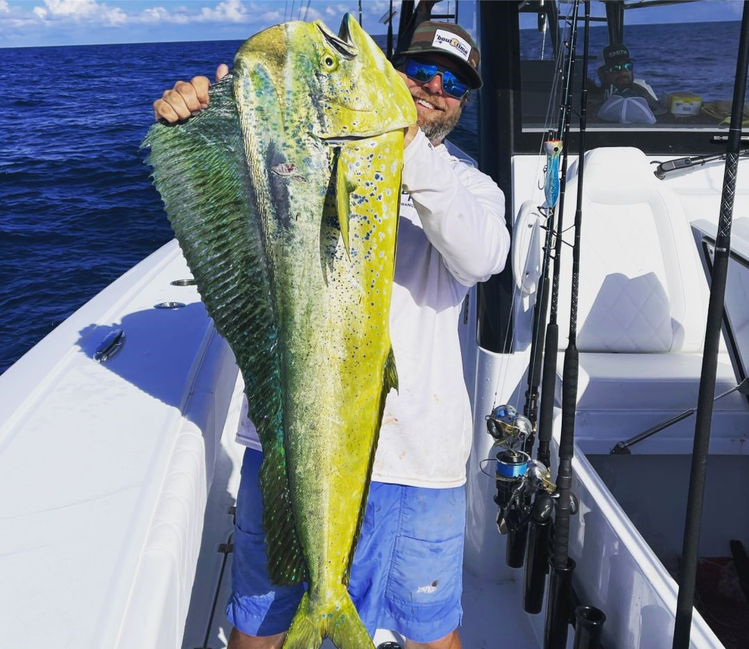 Anglers holding a large 41-inch fish in FL