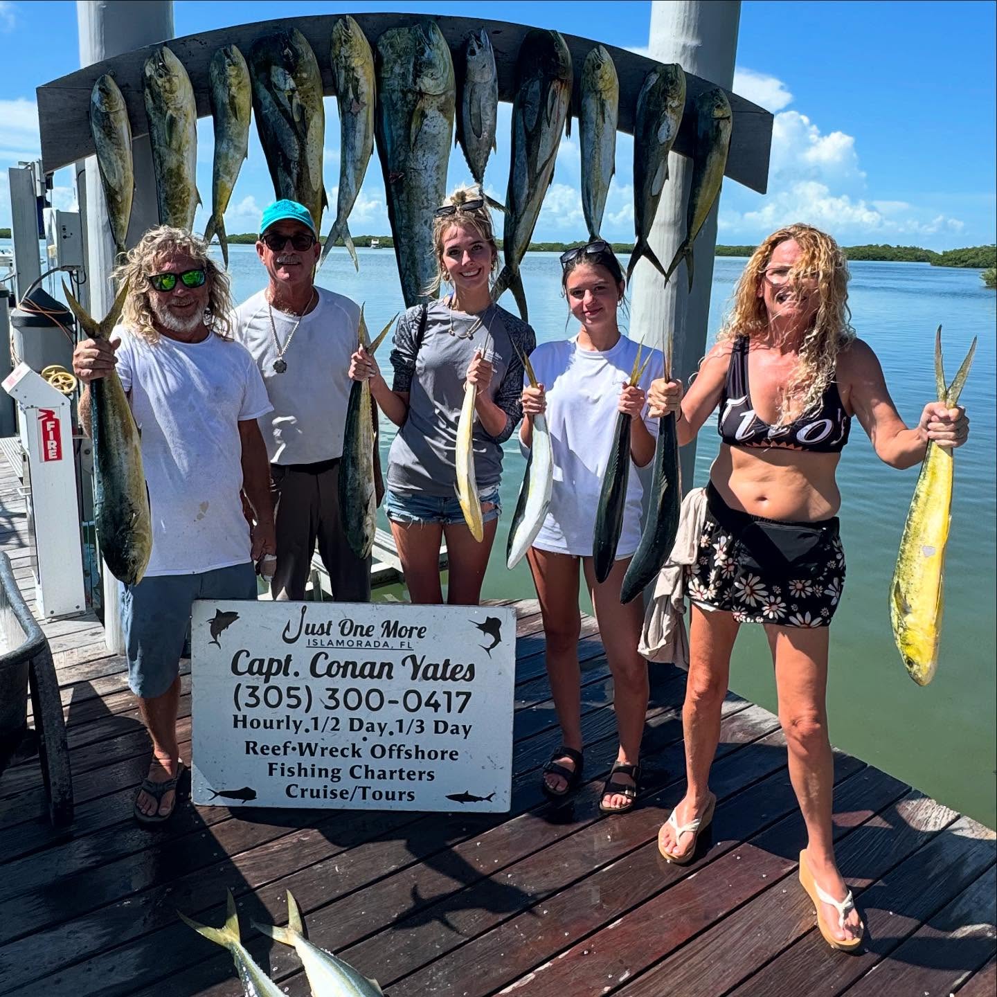 A group of 5 people fishing for 11 bluefish in Tavernier
