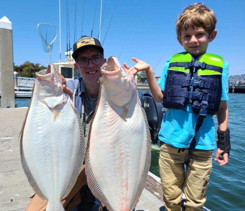 Two European flounder fish being caught in CA