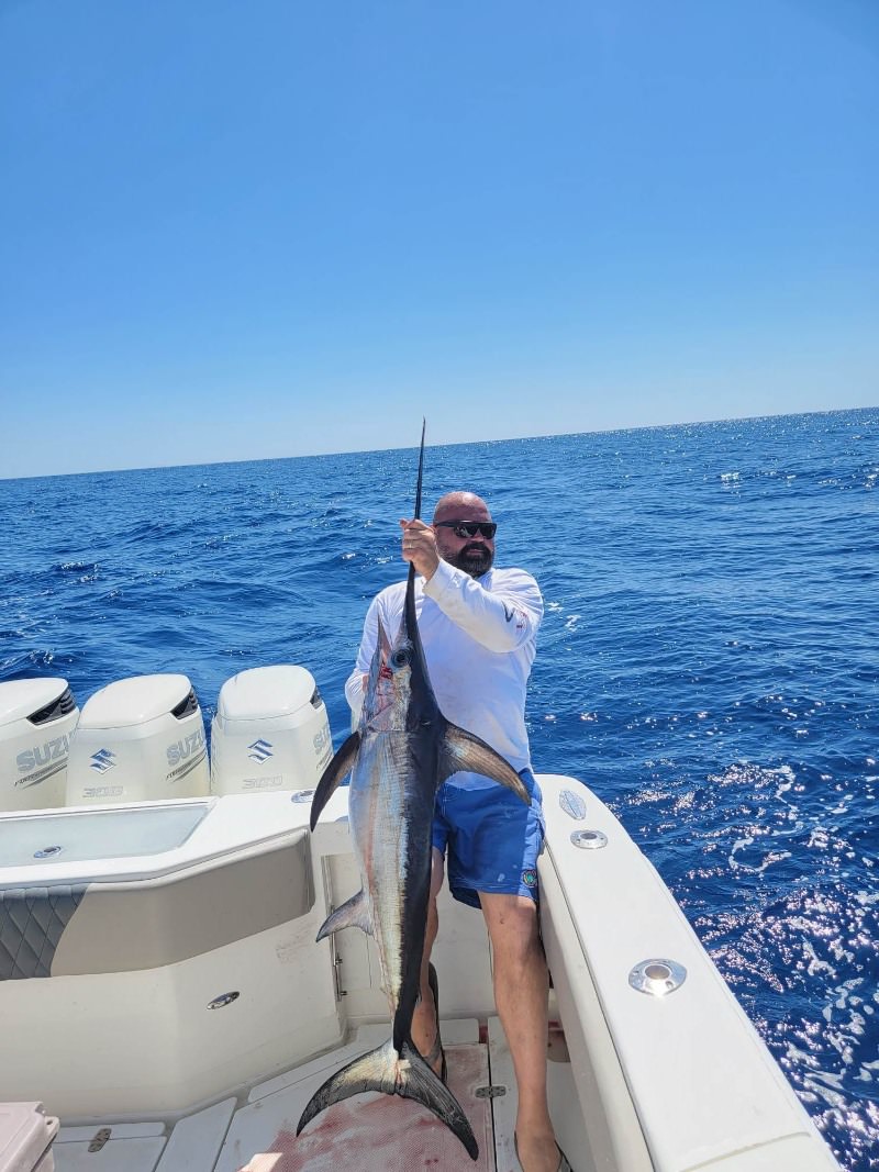 A photo of a blue marlin, a large and impressive saltwater fish caught during a fishing tour in Marathon.