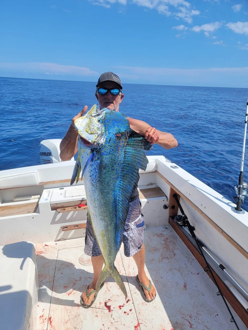 One fisherman reeling in a big catch while on a fishing tour in FL