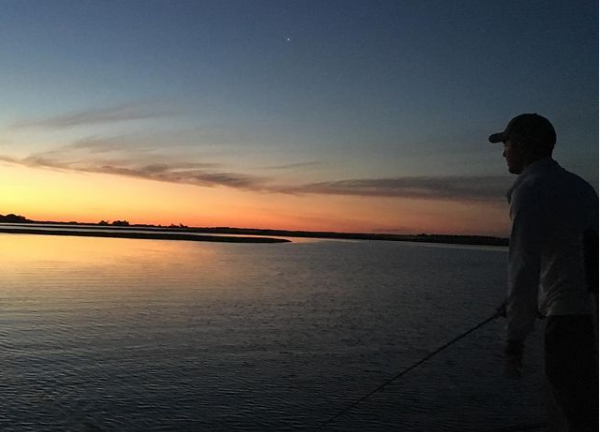 Person holding fishing rod in Rowley