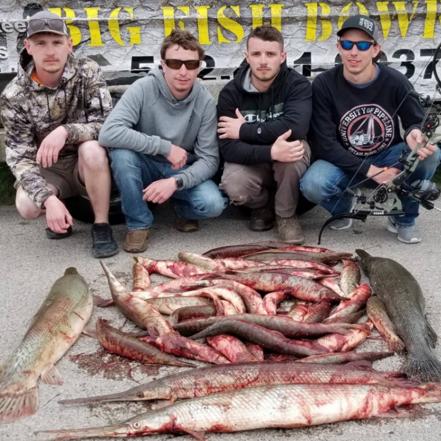 4 people holding 2 large fish at Hockley