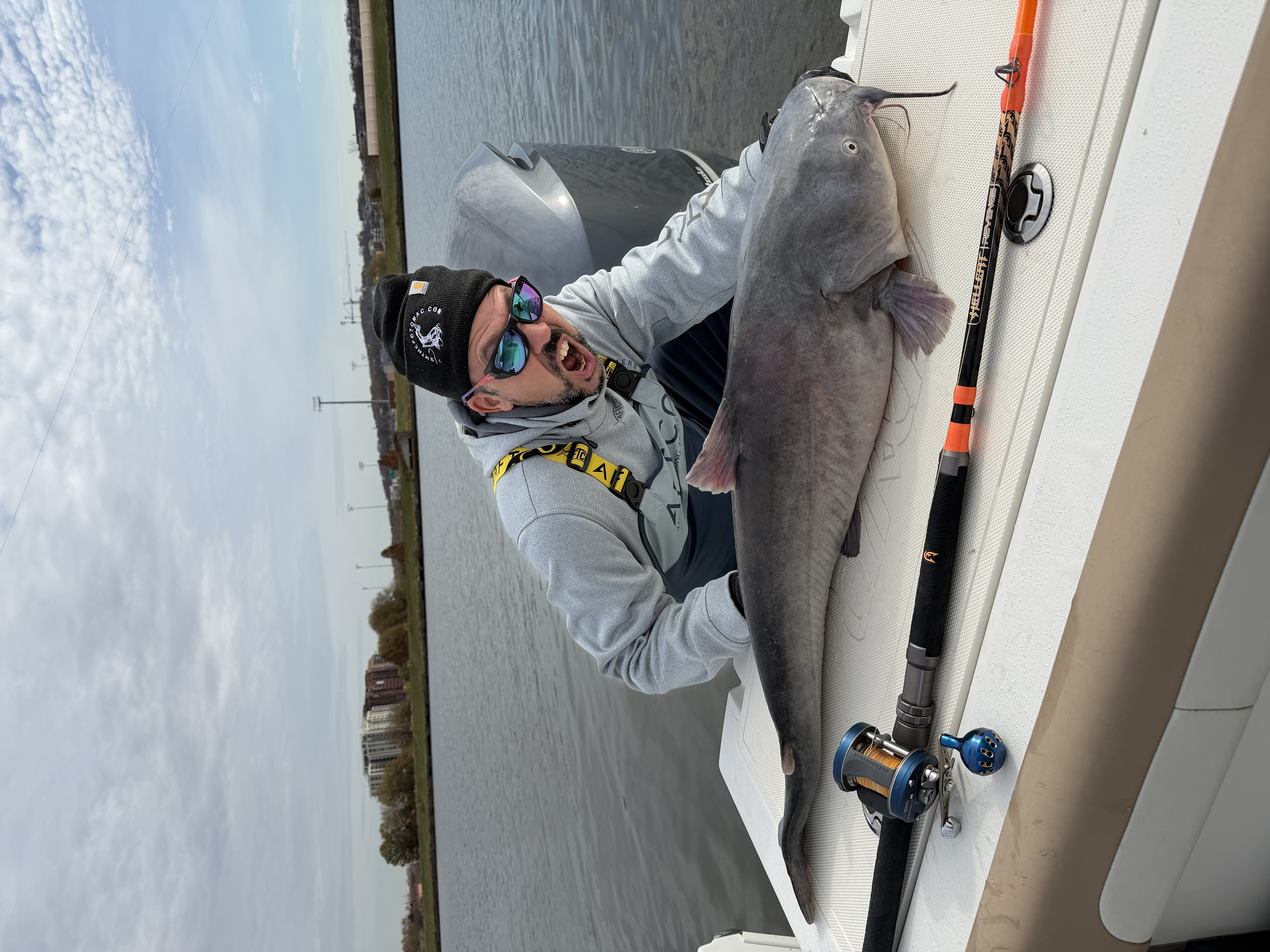 Angler holding a blue catfish in Washington, D.C.