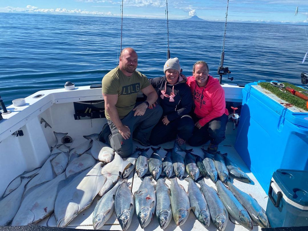 Three people fishing in Alaska