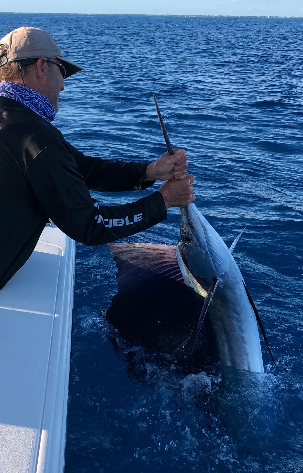 1 person proudly holds a 24-inch fish while fishing in FL