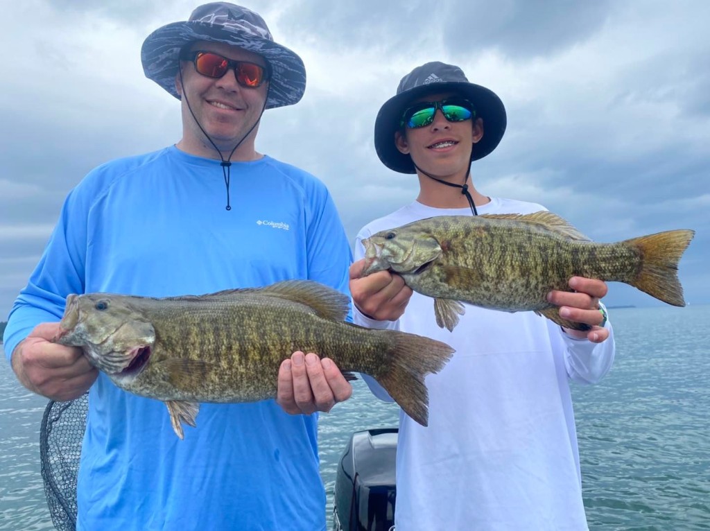 Two anglers fishing in PA with big 21-inch fish
