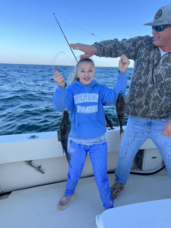 Two anglers enjoying a fishing trip in Destin
