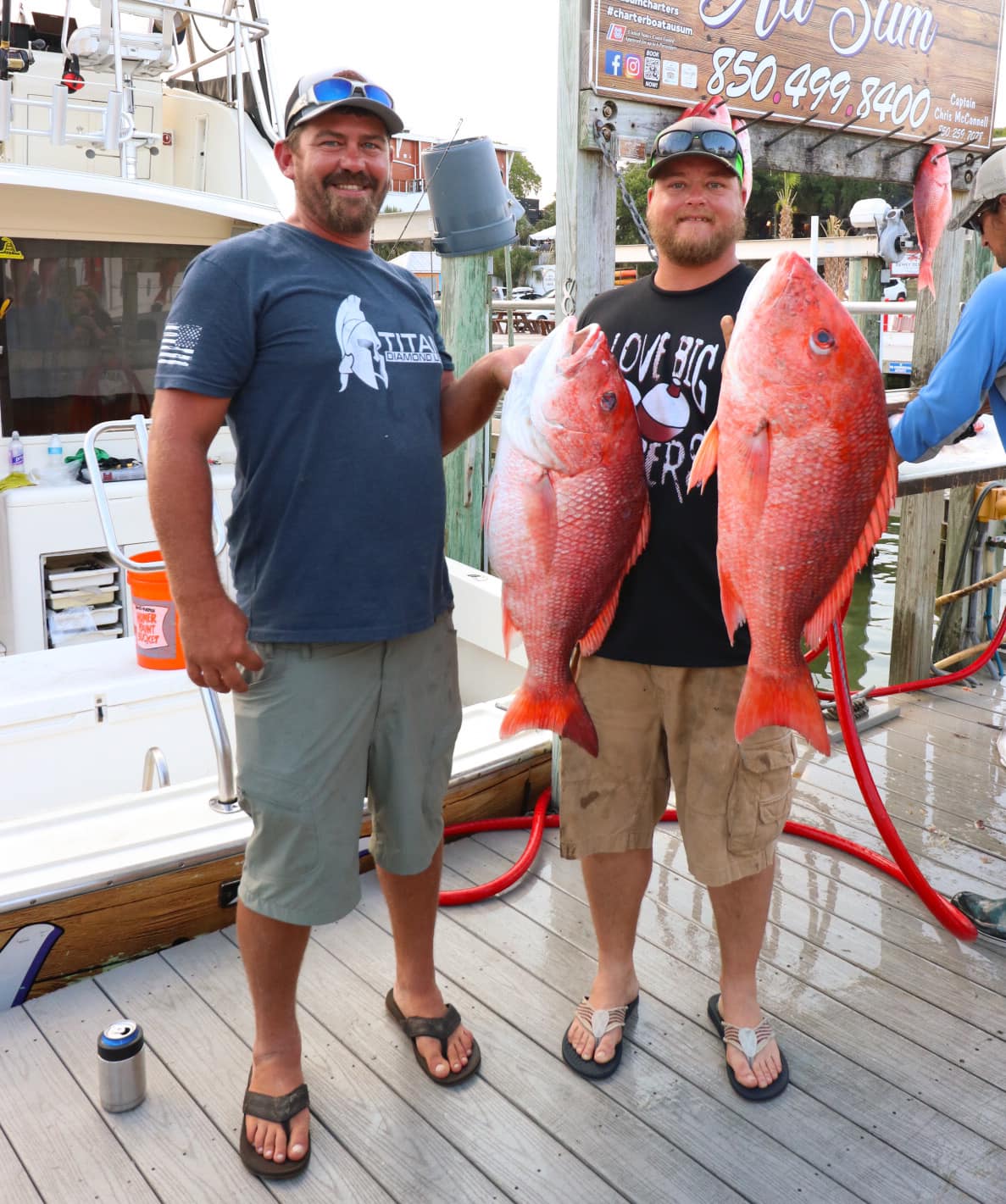 Two anglers fishing in Destin with two big fish