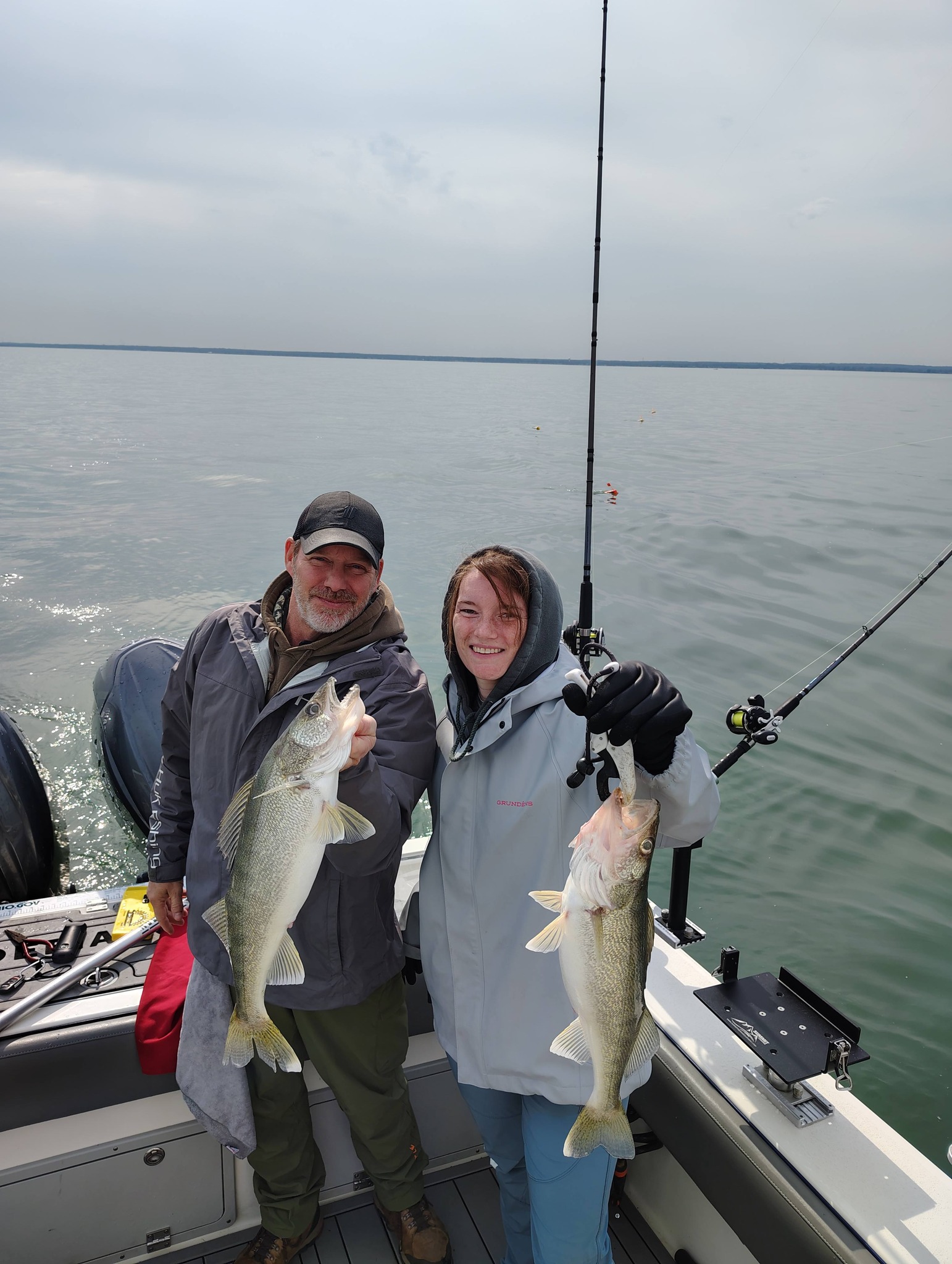 Two freshly caught walleye fish held on fishing boat in Geneva-on-the-Lake OH