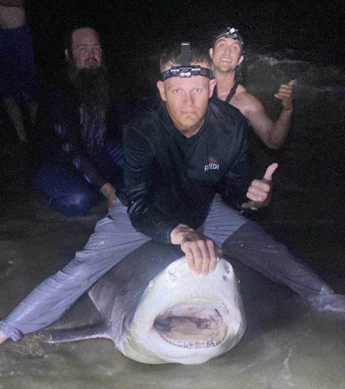 Three people enjoying a fishing trip at New Smyrna Beach