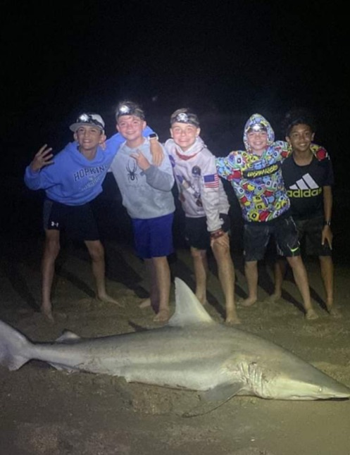 Kids shark fishing from beach at New Smyrna Beach with Captain Tyler - family-friendly inshore trip