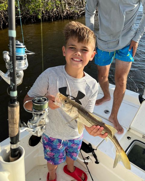 Angler fishing with rod in Placida