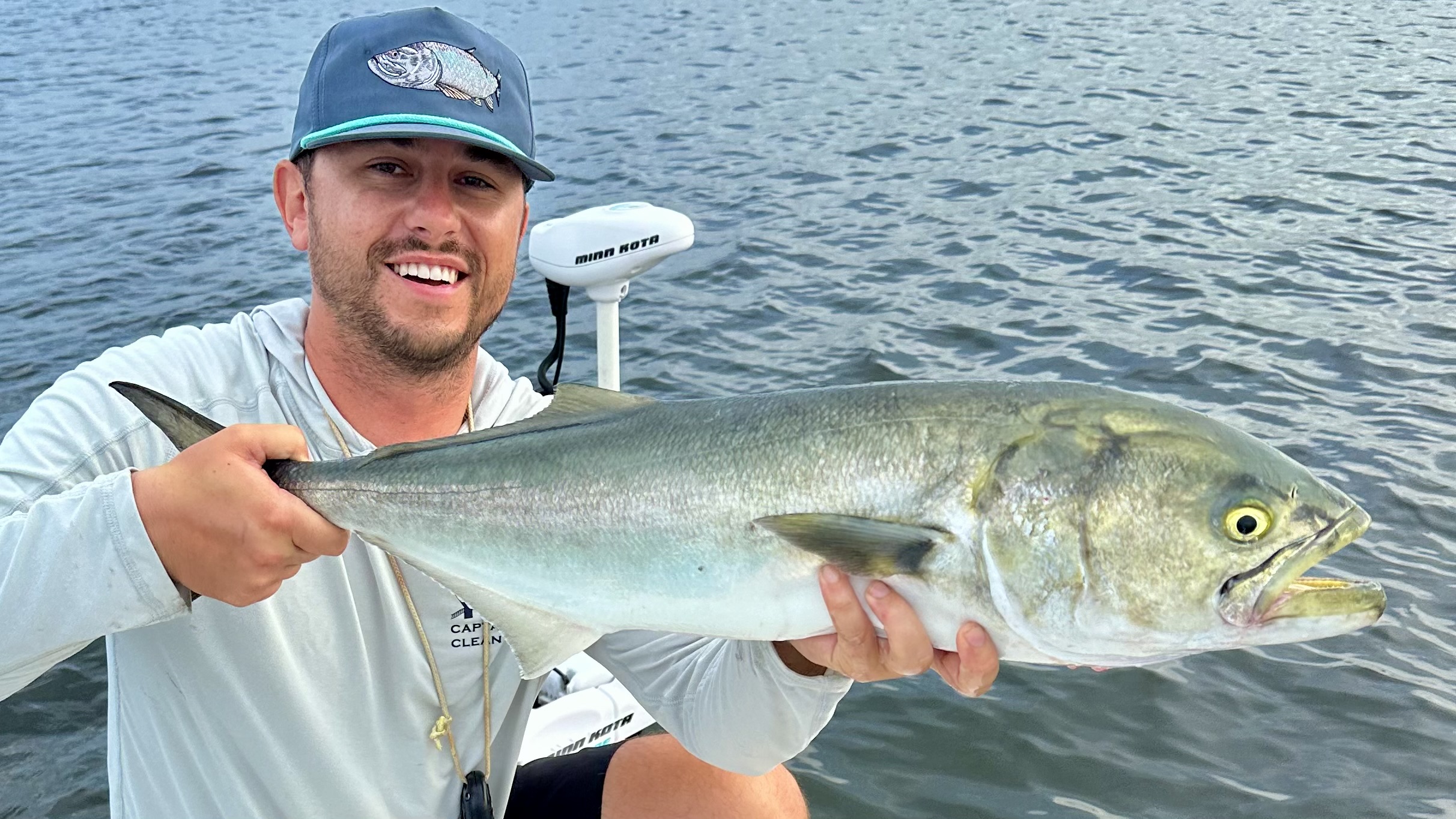 2 people fishing in Sarasota with a 25-inch fish