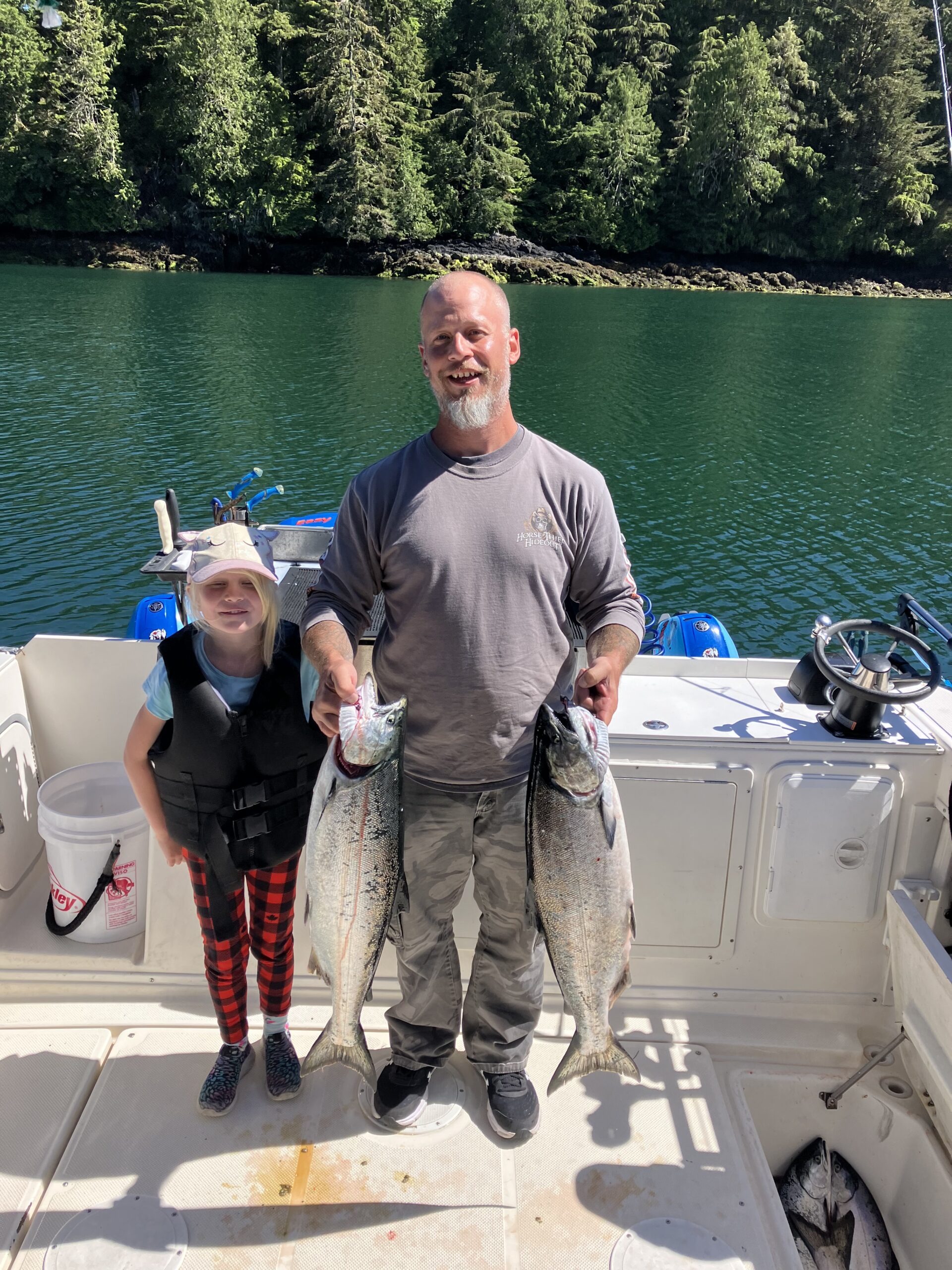Two Coho Salmon and Chinook Salmon, 22 inches long, caught in Ucluelet