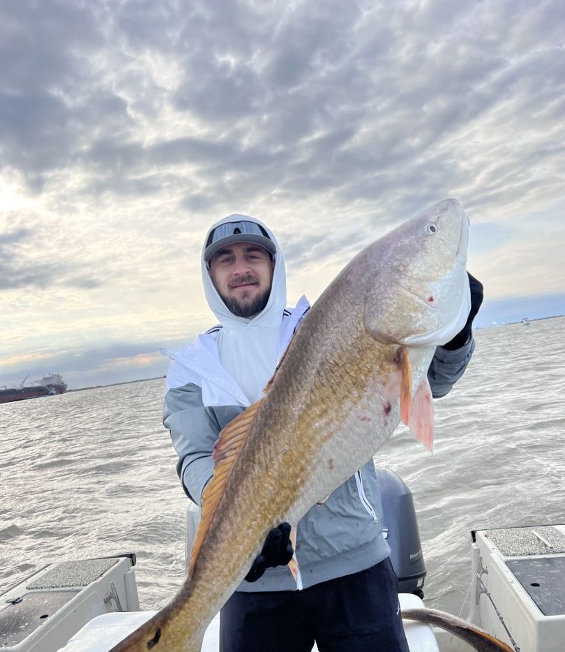 1 fisherman catching a fish in TX
