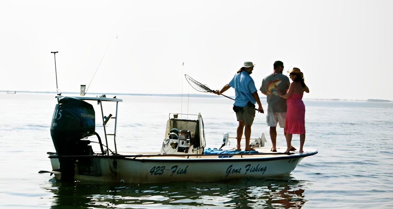 Three people fishing at Oak Hill