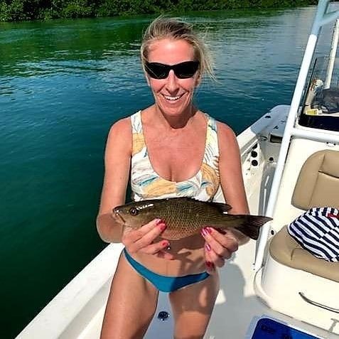 Lone angler holds rod in Islamorada, Florida
