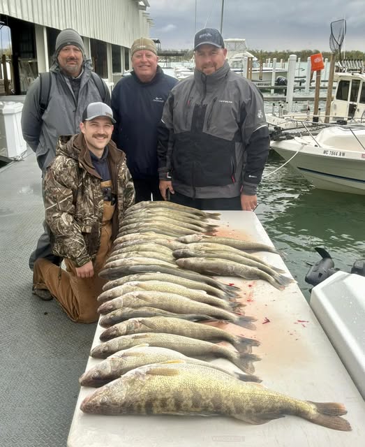 Fresh caught fish laid out on dock at marina in Traverse City MI after successful fishing trip