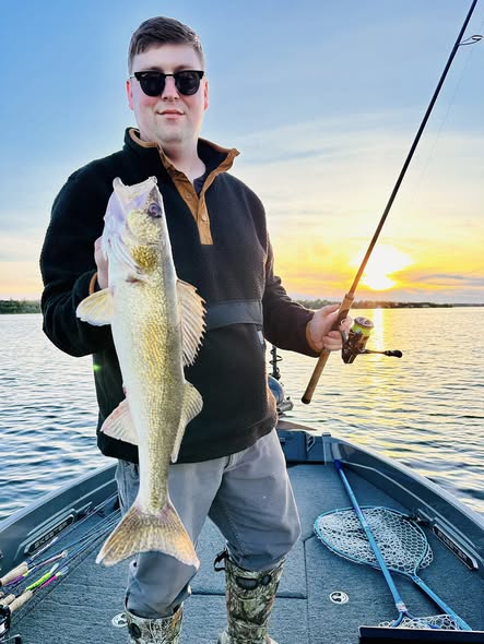 Walleye caught fishing on boat in Traverse City MI at sunset