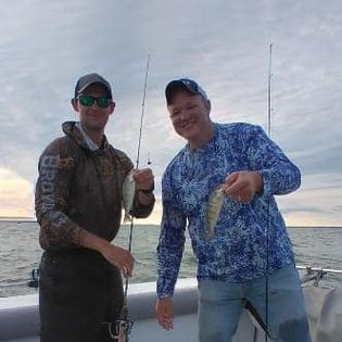 Two people enjoying a fishing tour in Port Clinton