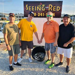 4 people enjoying fishing tours in Port Clinton