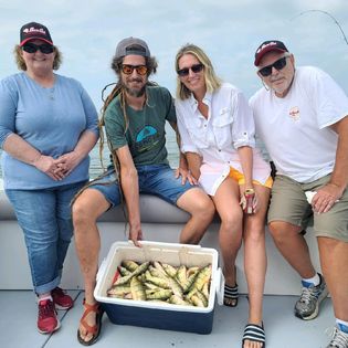 Group of 4 people fishing in Port Clinton