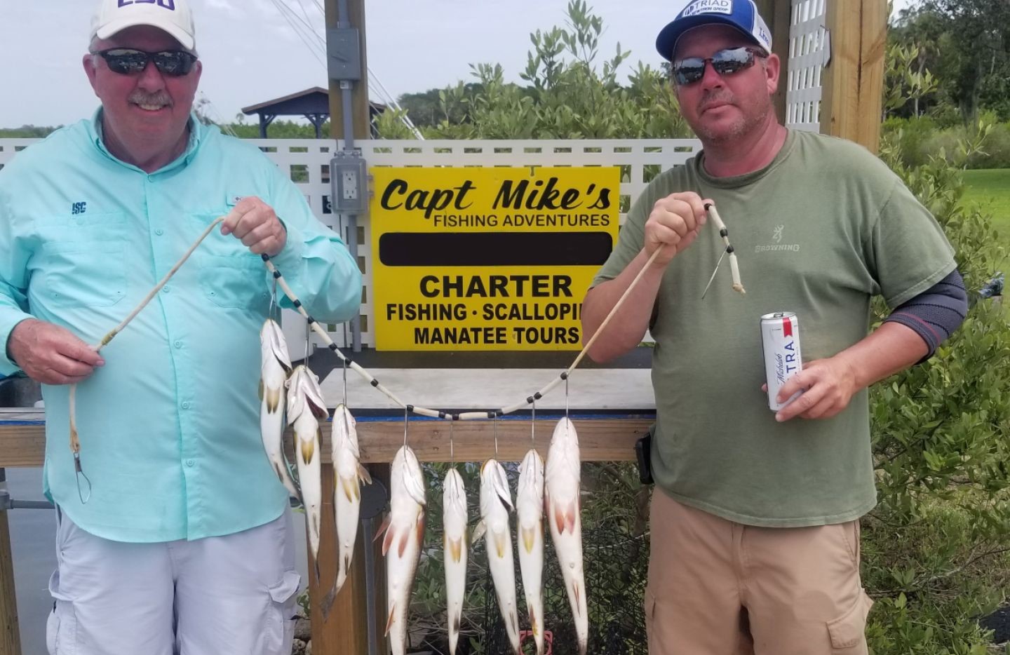 Successful fishing charter in Crystal River FL displaying multiple caught fish on stringer