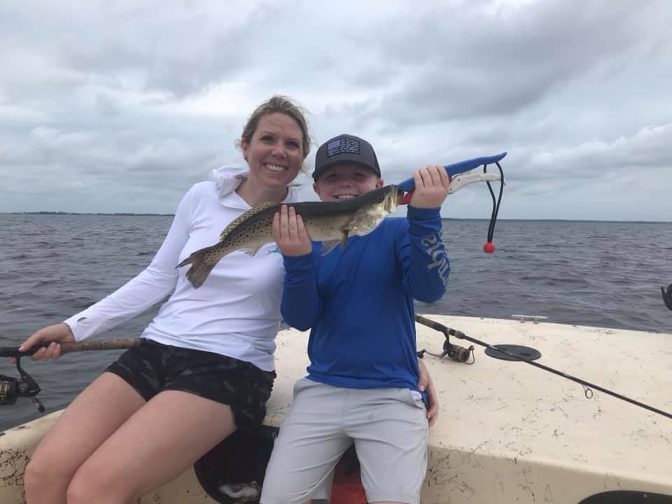 Two anglers fishing in St Marks with one catch