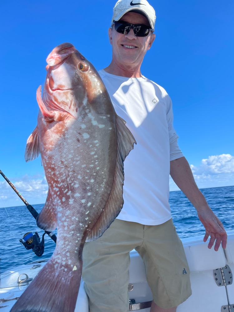 A person fishing in the beautiful waters of Port Canaveral