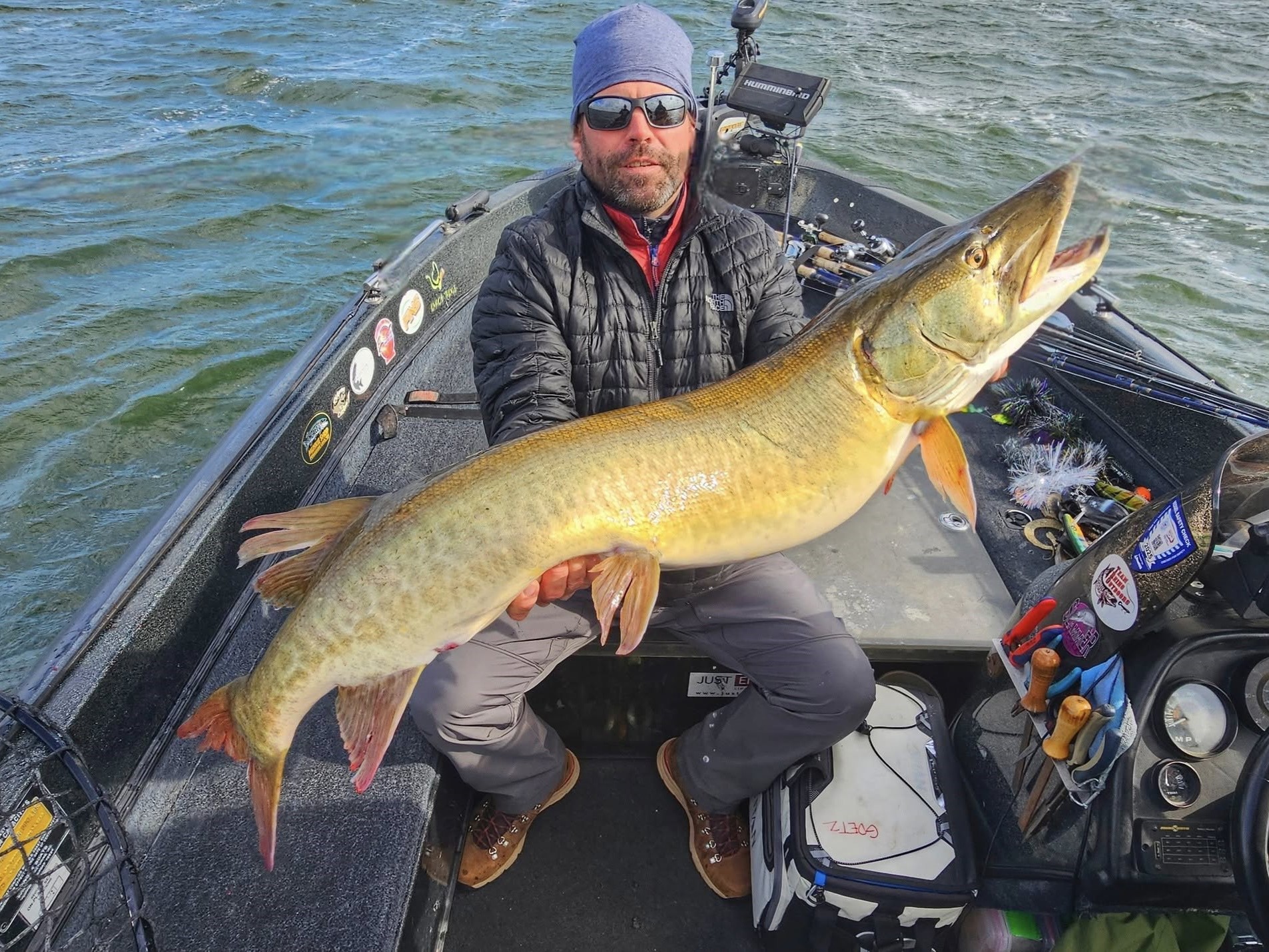 Large muskellunge caught fishing in Waukesha Wisconsin displayed on fishing boat