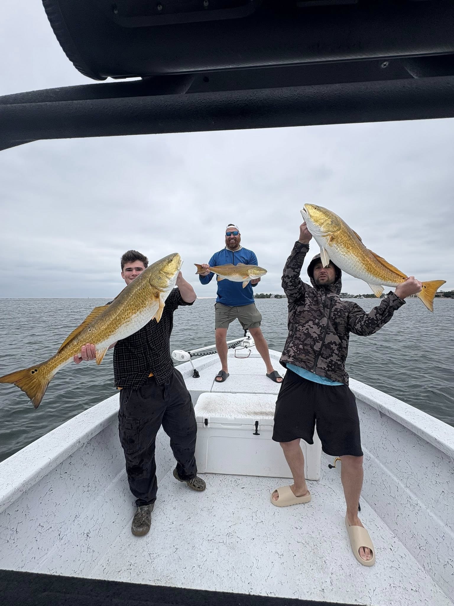 Three large redfish caught during fishing charter in Pensacola FL