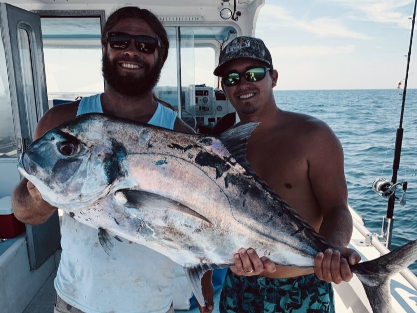 Pensacola deep sea fishing boat with anglers catching red snapper and grouper in Gulf waters
