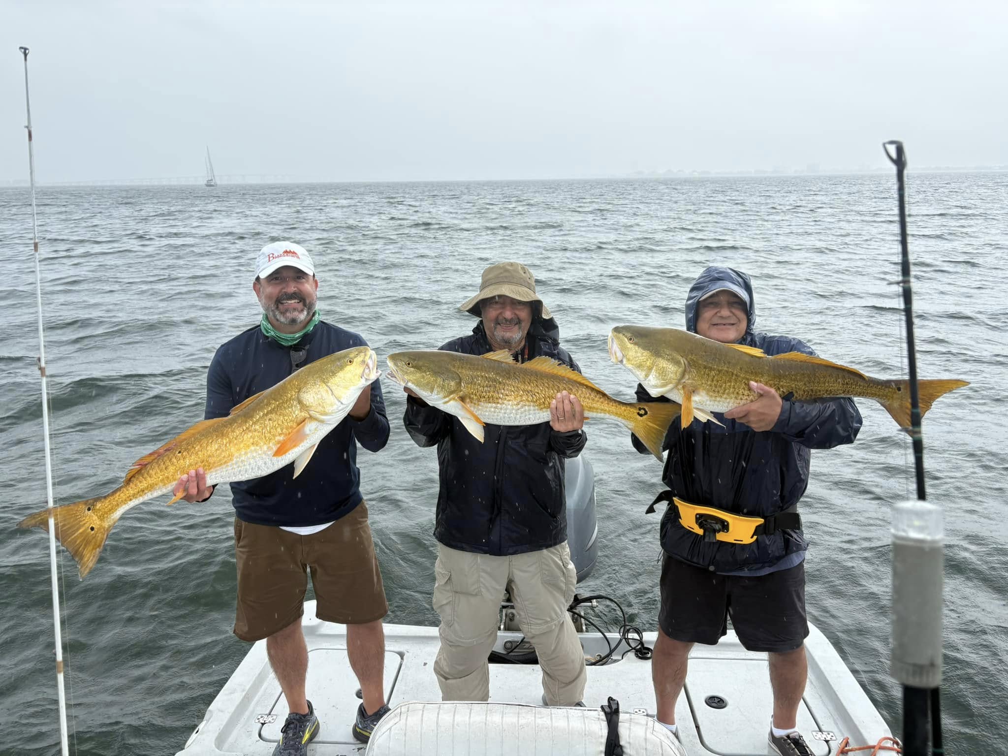 Deep sea fishing boat with anglers catching snapper and grouper in Pensacola Gulf waters