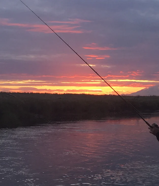A scenic view of Homer, Alaska with fishing equipment
