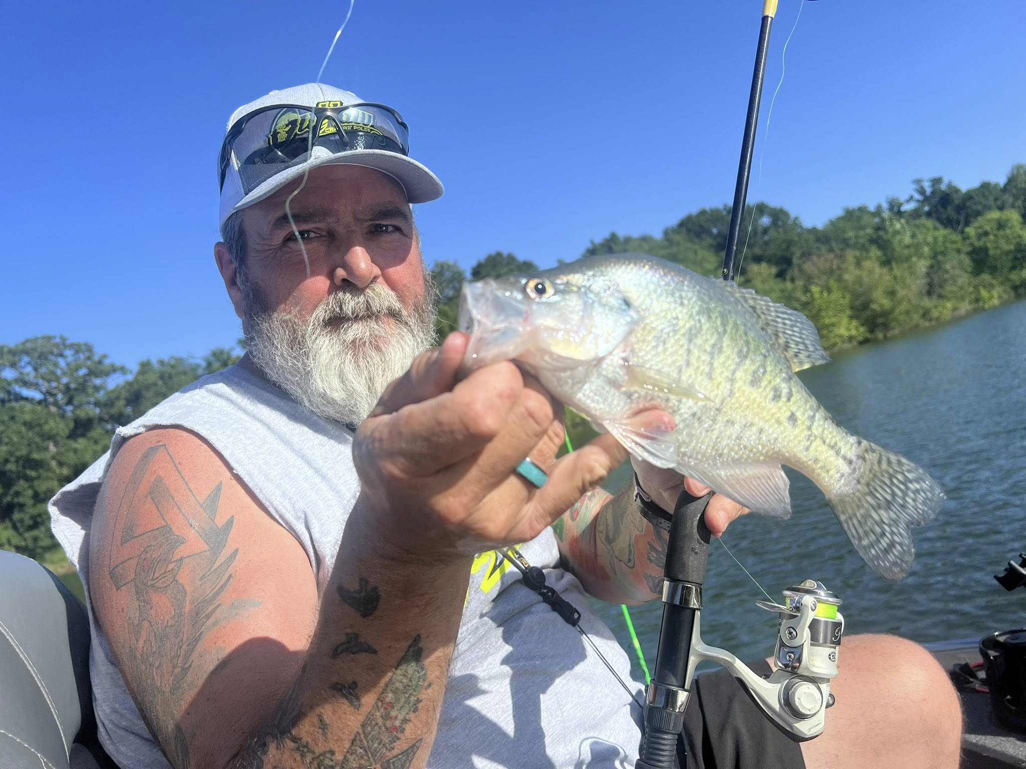 Crappie fishing guide boat on Missouri Ozarks lake with fishing equipment ready for 6-hour trip