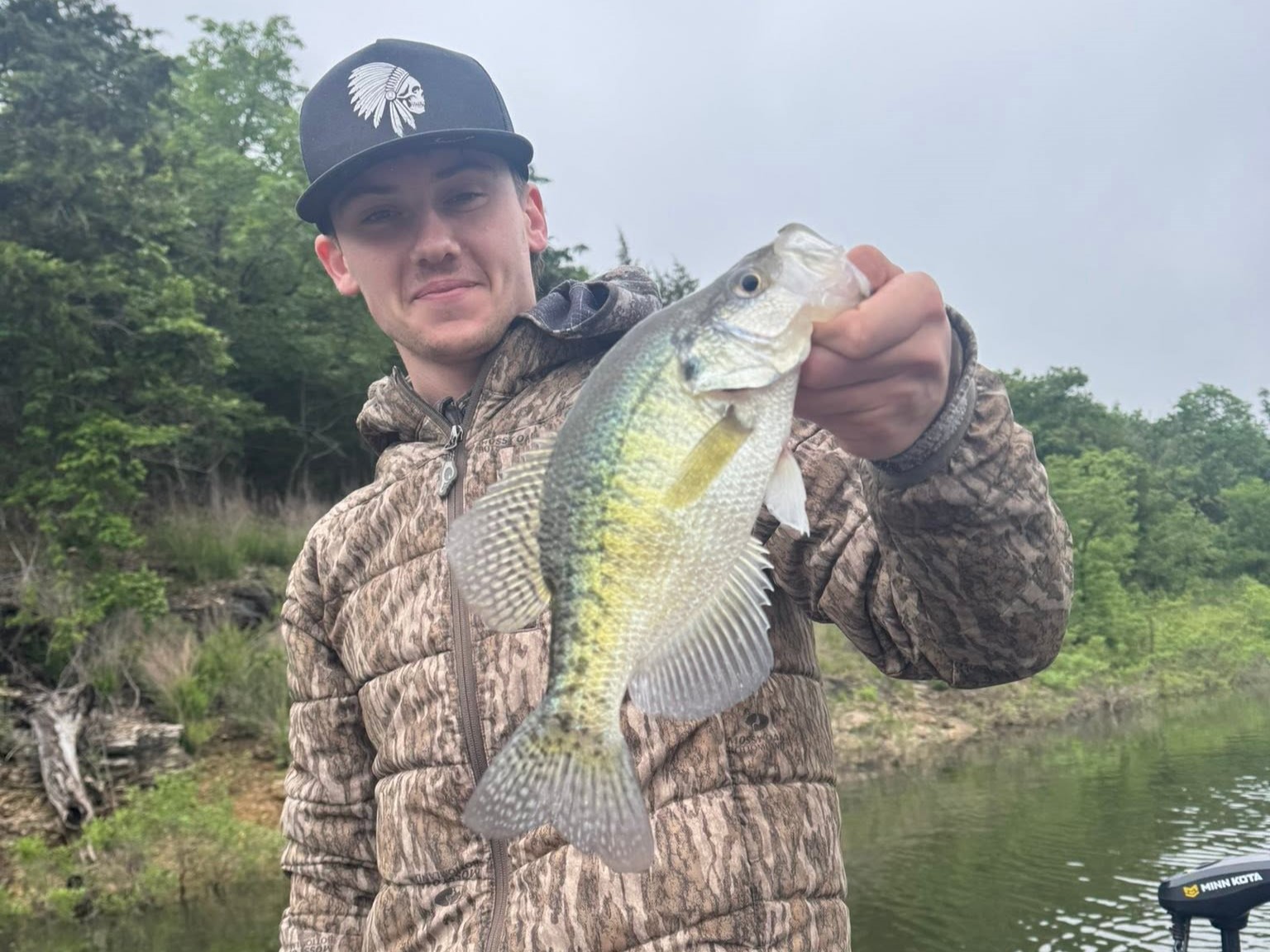Missouri Ozarks crappie fishing guide boat on lake with anglers catching fish 8-hour trip