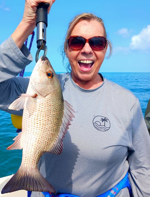 Catching a grey snapper fish in FL