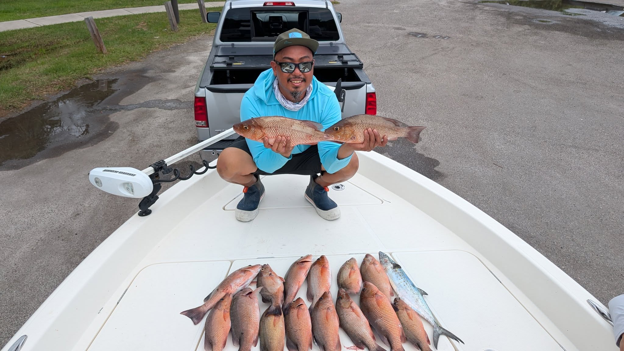 Successful fishing trip in St. Petersburg FL showing Spanish Mackerel and Grey Snapper catch on boat deck
