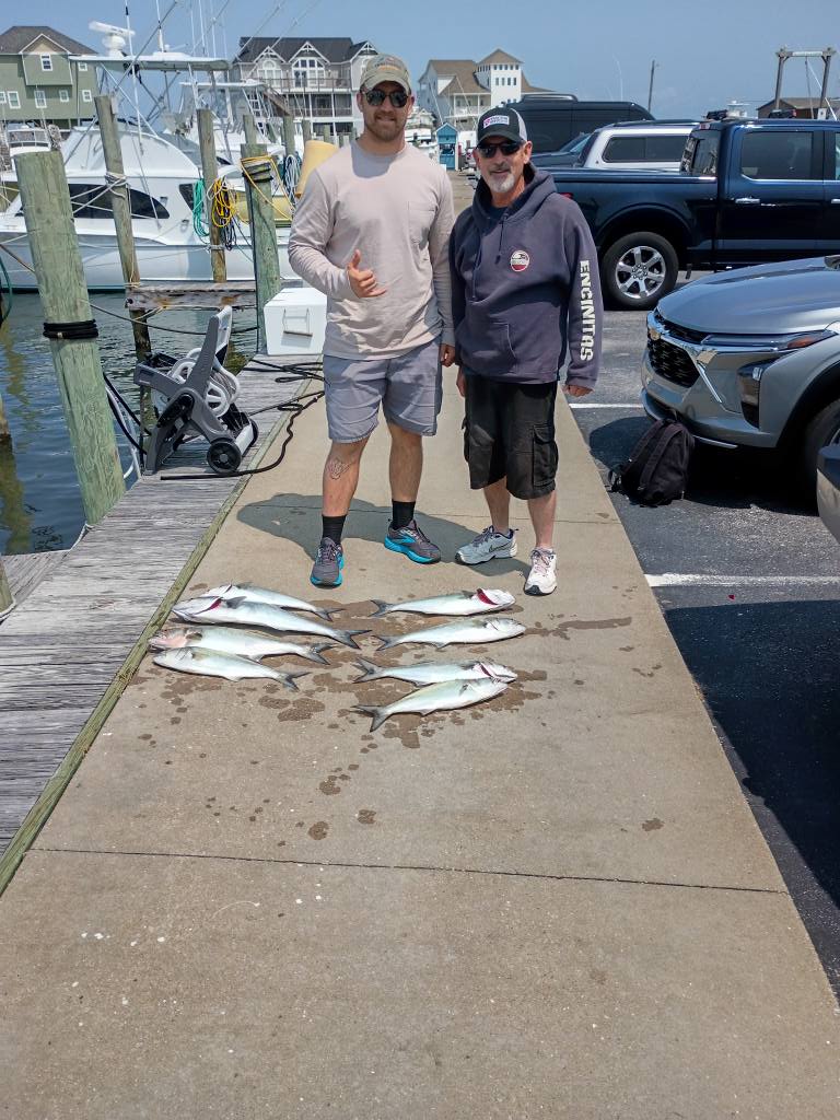 Fresh caught bluefish displayed on dock after successful fishing trip in Frisco NC