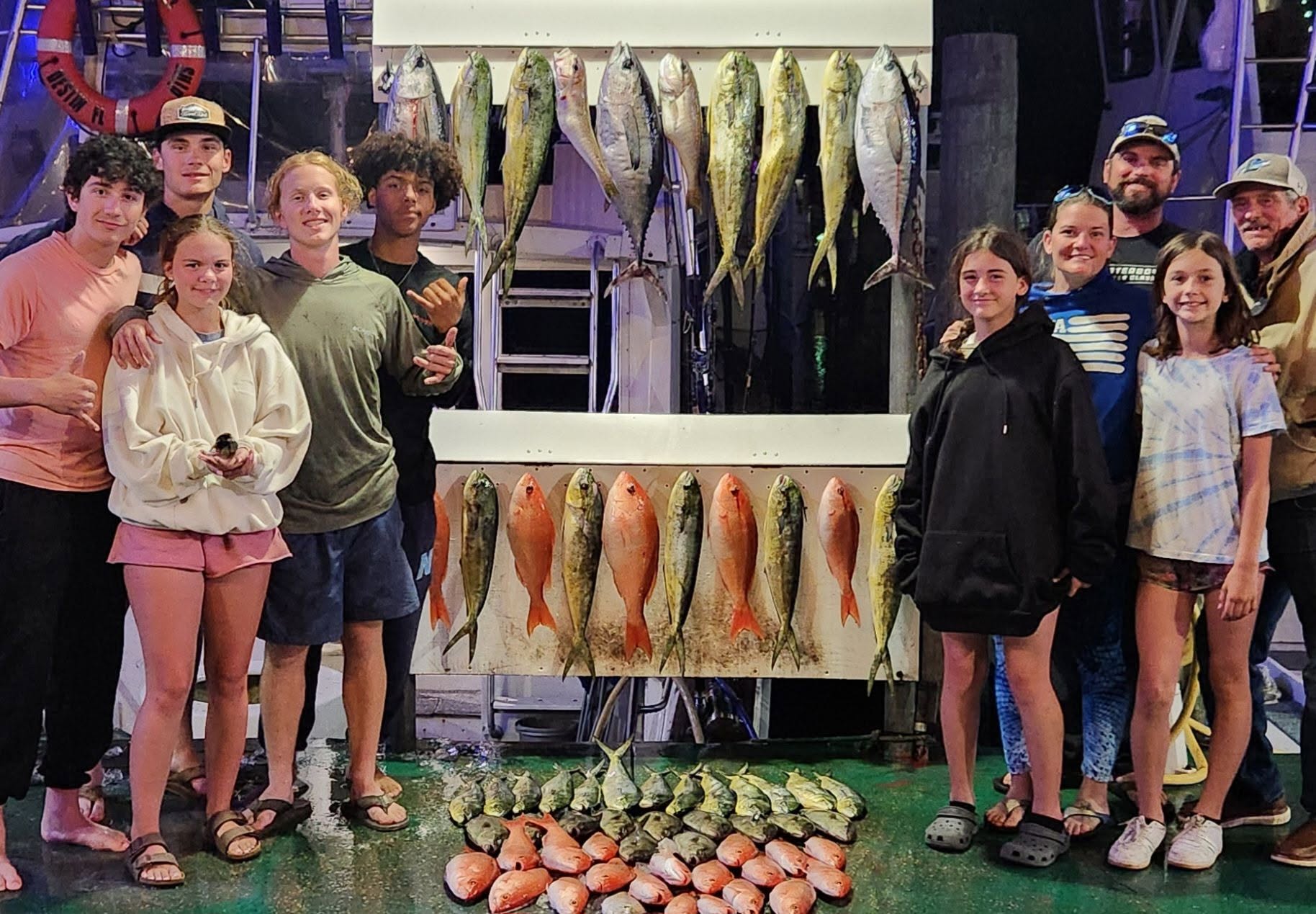 Destin Florida offshore fishing charter boat with captain and anglers catching red snapper