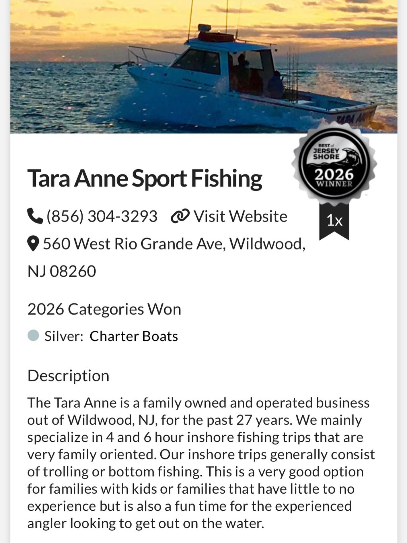 Blue fishing charter boat on ocean water at sunset in Wildwood NJ