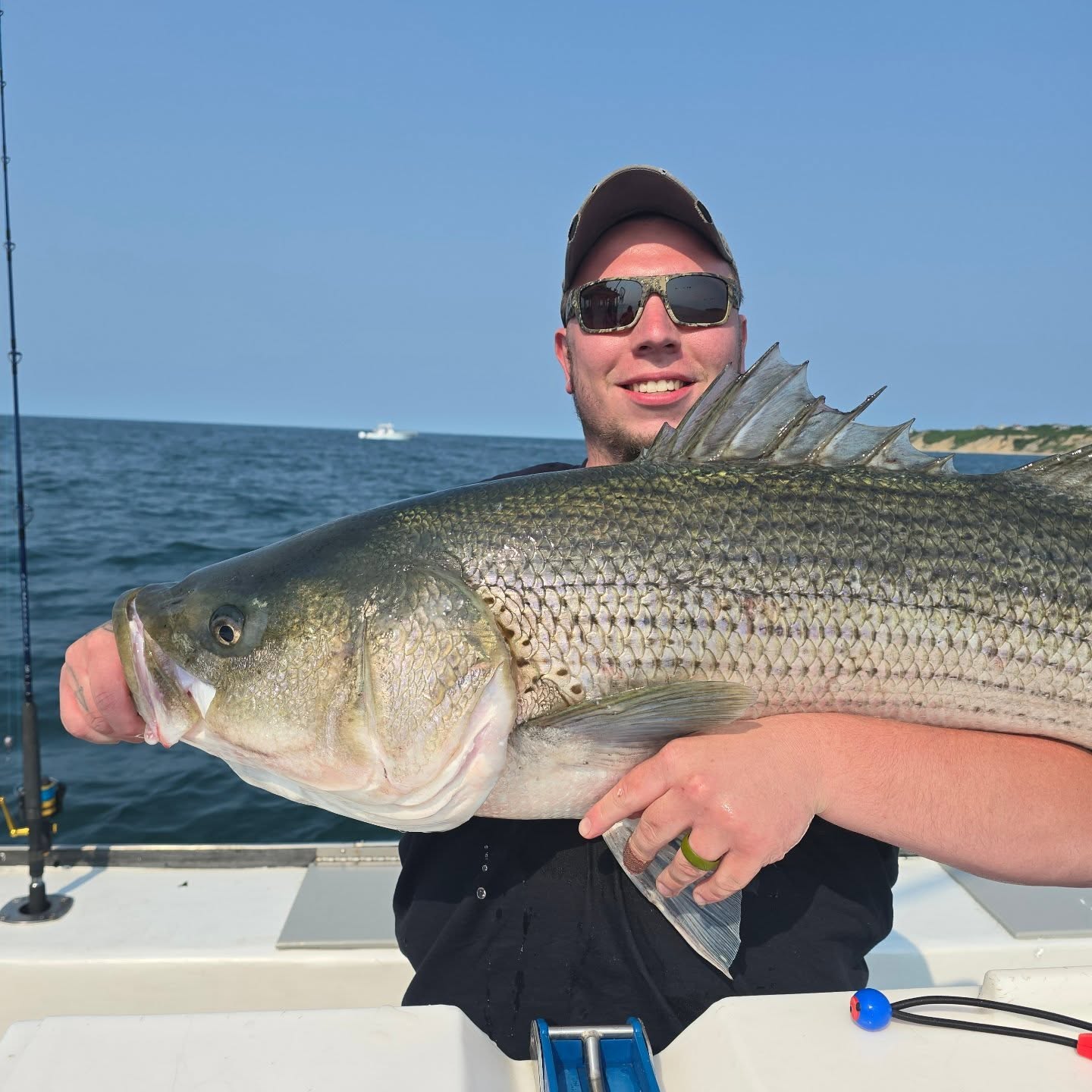 Fisherman with rod in Narragansett