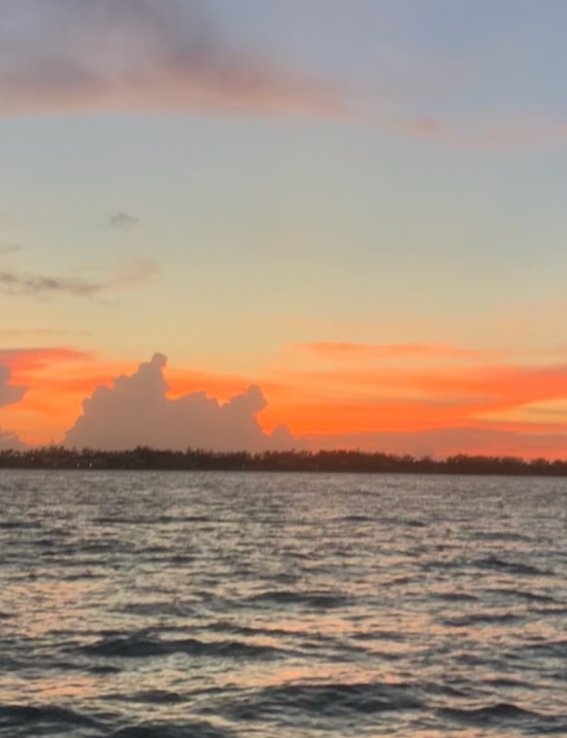 Night offshore fishing boat with captain targeting snapper and grouper in evening waters
