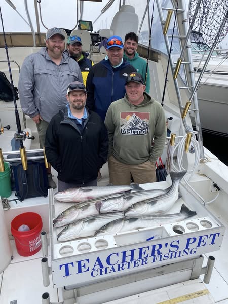 Group of 6 people enjoying fishing trip in NJ