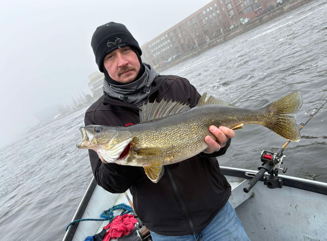 Angler fishing in Oswego